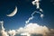A fantasy of night sky cloudscape with stars and a crescent moon overlaid
