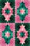 Fantasy patchwork pattern in pink and green tones.