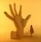 Fantasy, sci-fi, post apocalyptic landscape. Statue of a hand sticking out of the ground and a hooded girl looking at it