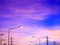 Fantasy sky background with pink clouds and highlight of streetlight after sunset