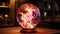 Fantasy style plasma ball. Multi-colored lightning in a glass sphere. Shining energy in the ball. Glass ball on the table. Magic