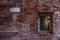 Fantasy view of a colorful brick wall and sign.