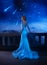 Fantasy woman princess stands on balcony looks at night sky space cosmos stars. Girl enjoy magic starfall ball. Elegant