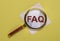 FAQ acronym through magnifying lens or glass