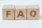 FAQ Frequently Asked Questions concept, cube wooden block with a