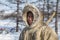 Far north of Yamal, tundra, pasture nord reindeers, closeup portrait of Nenets at age, close-up portrait of Nenets in national