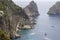 Faraglioni, attractive coastal rock formation eroded by waves, located off the coast of the island of Capri in the Gulf of Naples