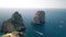 Faraglioni in Capri, Italy. Famous landmark from the drone viewpoint in summer season, Campania