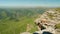 Faraway view of balance pyramid on the edge of hill on plateau Bermamyth on sunny summer day. Amazing view of Russian