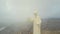 Faraya Mountain and Saint Charbel Statue drone view in a cloudy day