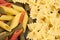 Farfalle and colored penne texture