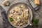 Farfalle pasta with champignon mushrooms and garlic creamy sauce