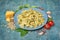 Farfalle pasta with ingredients for pesto sauce