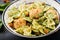 Farfalle pasta with meatballs and spinach sauce with fried chickpeas.