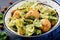 Farfalle pasta with meatballs and spinach sauce with fried chickpeas