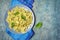 Farfalle pasta with pesto sauce and basil