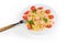 Farfalle pasta with shrimp and tomatoes on dish with fork