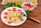 Farfalle pasta with shrimps and tomatoes on dish, fork, ingredients