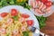 Farfalle pasta with shrimps and tomatoes, fork, ingredients, top view