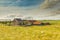 Farm with barns a haystack and meadow with sheep