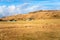 Farm Buildings at the Foot of Hill and Blue Sky