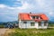 Farm country house in the field. Countryside of Canada. Rural Farmhouse with barns on a sunny day in a summer