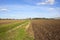 Farm ditch with plowed fields