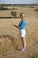 Farm employee in field of wheat