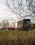 Farm equipment in field on cloudy winter day