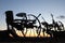 Farm equipment at sunset