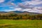 Farm field and autumn color in the White Mountains near Jefferson, New Hampshire.