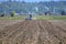 Farm Field and Plowing Tractor