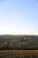 Farm in the hills in the warm light of sunset. Countryside and agriculture in winter