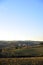 Farm in the hills in the warm light of sunset. Countryside and agriculture in winter