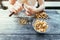 Farm holidays: Woman is preparing delicious chanterelle mushrooms on an old rustic wooden table