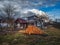 Farm house with firewood in early spring