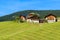 Farm houses on hill in Val Di Funes mountain valley, Dolomites