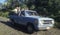 Farm laborers ride to work in back of truck