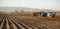 Farm machinery harvesting Idaho potatoes.