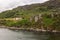 Farm mansion on rocky hill off Loch Carron, Scotland.