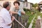 Farm neighbors talking at fence