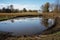 farm pond, with visible black runoff from nearby fields