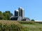 Farm scene with silos behind a 3 section barn in southern wisconsin