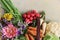 Farm still life composition. Harvest, gardening concept. Fresh organic assorted vegetables and autumn garden flowers in