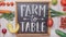 Farm to Table sign with fruits and vegetables.