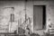 Farm tools near wall of old shed