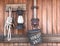 Farm tools rope, lamp, horse bucket hanging on wooden wall - r