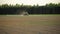 Farm tractor fertilize spray wheat field with sprayer from pesticide herbicide