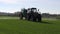 Farm tractor spray autumn green crop field