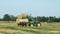 Farm tractor with stacked bales